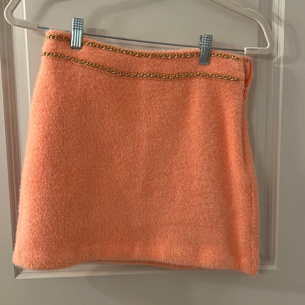W.A.P.G peach skirt. Gold chain detailing.